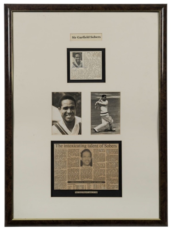 SIR GARFIELD SOBERS: A framed display featuring an original signature, two original press photos and a newspaper article by Don Bradman titled "The intoxicating talent of Sobers". Overall 75 x 56cm.