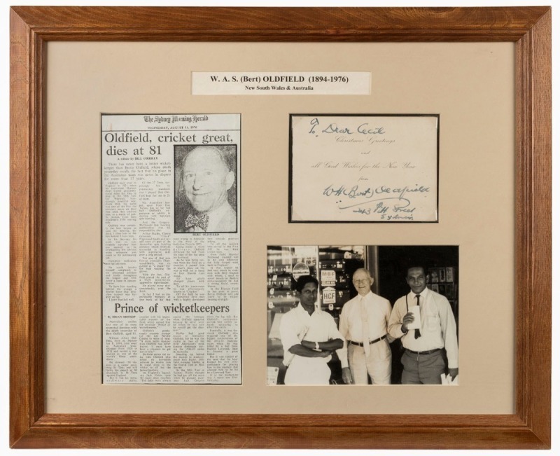 BERT OLDFIELD: An undated Cricketers Club of New South Wales Christmas card from Oldfield to Cecil Cooke with pen signature and written message, attractively framed and glazed together with an original photograph of Oldfield with two visiting cricketers o