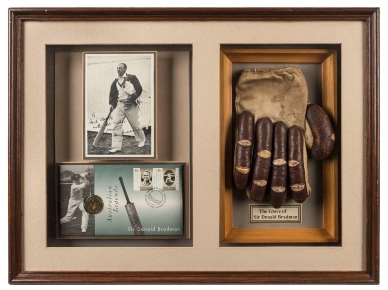 DON BRADMAN'S RIGHT HAND BATTING GLOVE: Attractively mounted, framed and glazed together with an original photograph signed and dedicated by Bradman and accompanied by correspondence (December 1975 and January 1976) between Bradman and Cooke in which Brad