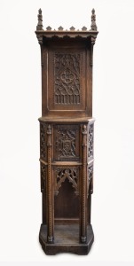 An antique oak hall cabinet carved in the Pugin Gothic style, early 20th century, 229cm high, 56cm wide, 34cm deep