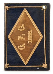 1886 Carlton membership season ticket, covered in gilt tooled dark blue and pale brown leather binding; the interior surfaces with printed details of the club leadership and the fixtures for the club's first and second teams, overall 7.5 x 10.3cm when ope