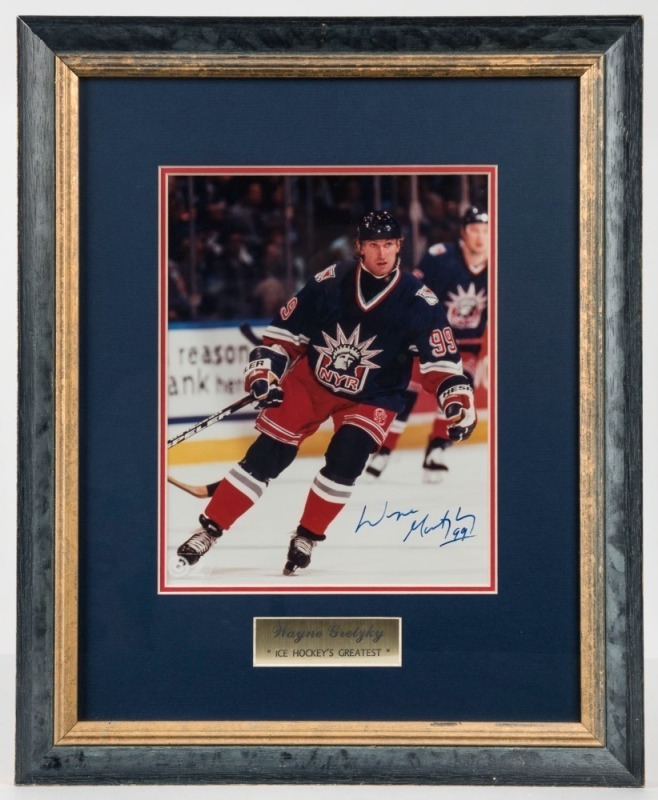 WAYNE GRETZKY 99 original signature on an action photograph with certificate of authenticity, attractively framed and glazed. Overall 45cm x 36cm 