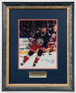 WAYNE GRETZKY 99 original signature on an action photograph with certificate of authenticity, attractively framed and glazed. Overall 45cm x 36cm