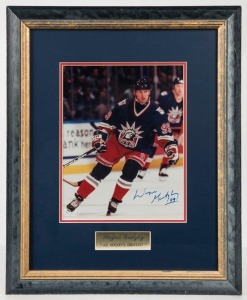 WAYNE GRETZKY 99 original signature on an action photograph with certificate of authenticity, attractively framed and glazed. Overall 45cm x 36cm 
