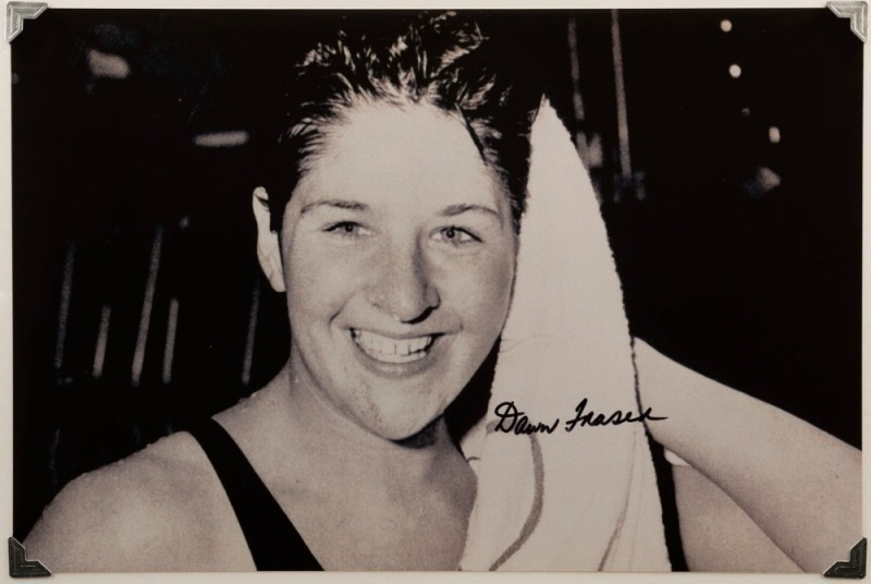 DAWN FRASER, original signature on a lovely photograph of her following a gold-medal swim at the Rome Olympics, 20 x 30cm.