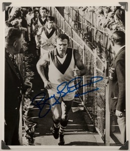 BOBBY SKILTON original signature of him leading the Swans up the chase for a game, 23 x 20cm.