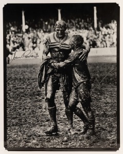 NORM PROVAN and ARTHUR SUMMONS, original signatures on a large format print of the iconic photograph by John O'Gready, known as "The Gladiators"; overall 43 x 34cm.