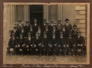 The 1914 PREMIERSHIP The Carlton team and officials photographed in Adelaide, with hand-written title at base "Carlton F Club. Premiers of Vic. Visit to Adelaide 2/10/14. Framed & glazed, overall 42 x 52cm.
