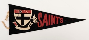 ST. KILDA: a circa 1950s "The Saints" pennant (39cm long) with a contemporary enamel and brass lapel pin, (2 items). Superb condition.