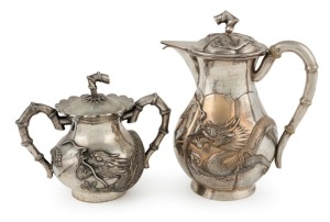 A Chinese export silver hot water pot and matching sugar basin with dragon decoration, 19th/20th century, seal mark to base of basin, 11.5cm and 17.5cm high, 716 grams total