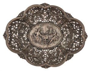 A German silver pierced bowl with repousse interior scene decoration, 19th/20th century, stamped "800" with crown and crescent mark, ​​​​​​​32cm wide, 454 grams