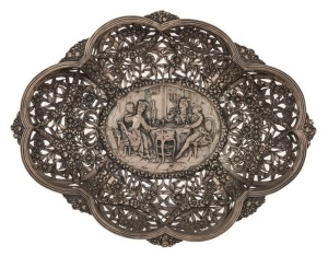 A German silver pierced bowl with repousse interior scene decoration, 19th/20th century, stamped "800" with crown and crescent mark, 32cm wide, 454 grams