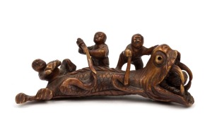 An antique carved ivory sea monster ornament, 19th century, ​​​​​​​11cm long