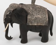 An antique Indian silver mounted ivory ornament resting on two carved ebony elephants, 19th century, an impressive 51cm high, 74cm long - 2