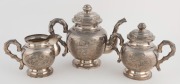 A Vietnamese silver tea set comprising a teapot, milk jug and sugar basin, together with five cups and saucers, 20th century, ​​​​​​​the teapot18cm high, 1930 grams - 3