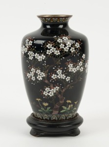 A Japanese cloisonne vase with blossom decoration on black ground, Meiji period, 19th/20th century, 12cm high, 14.5cm high with stand