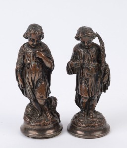 A pair of antique metal statues with remains of silvered finish, 19th century, 14cm high