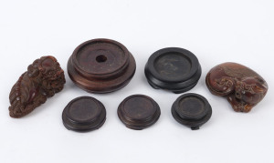 138 · Two carved horn Chi-Long figures, together with five assorted timber stands, 19th and 20th century, (7 items), ​the carvings 7.5cm and 6.5cm long