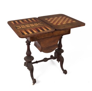 An antique English walnut sewing table with fold-over games top, 19th century, 74cm high, 61cm wide, 42cm deep