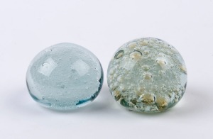Two art glass paperweights with bubble inclusions, 20th century, the larger 5.5cm high