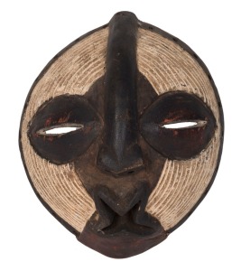 A tribal mask, carved wood with remains of piped clay decoration, Songye tribe, Congo, ​​​​​​​33.5cm high