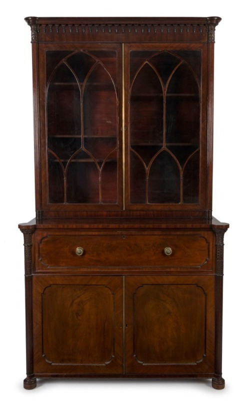 A fine antique Scottish mahogany library secretaire bookcase with full length reeded pilasters, carved palmette capitals and gothic arched astragal glazed upper doors. Interior superbly fitted with drawers and compartments, veneered in partridge wood, cir