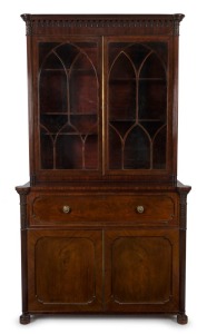 A fine antique Scottish mahogany library secretaire bookcase with full length reeded pilasters, carved palmette capitals and gothic arched astragal glazed upper doors. Interior superbly fitted with drawers and compartments, veneered in partridge wood, circa 1825, 225cm high, 132cm wide, 65cm deep