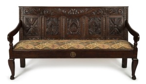 An antique English oak settle, 18th/19th century, 102cm high, 180cm wide, 66cm deep
