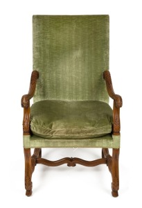 An antique French carved walnut armchair with green velvet upholstery, 118cm high x 65cm wide x 69cm deep 