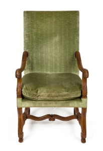 An antique French carved walnut armchair with green velvet upholstery, 118cm high x 65cm wide x 69cm deep