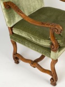 An antique French carved walnut armchair with green velvet upholstery, 118cm high x 65cm wide x 69cm deep  - 4