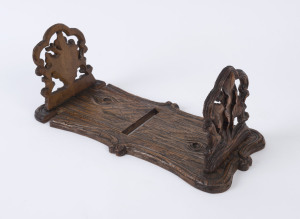 A Black Forest bookstand with carved oak leaf decoration, 19th century, 39cm wide