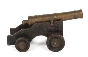 An antique miniature bronze canon on iron base. Full working trainee model, 18th/19th century, ​​​​​​​17cm long overall