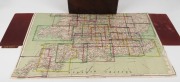 [ROAD MAPS OF ENGLAND & WALES]. Rare cased set of G. W. Bacon’s Motor Maps of England & Wales; housed in a lockable dark brown leather case with carrying handle which opens to a red velvet lined interior holding 30 individual, linen-backed folding maps, i - 2