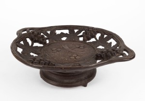 A Black Forest musical compote, 19th century, bearing original lithograph label to base, 10cm high, 33cm wide