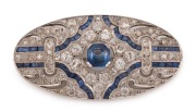 A Stunning Art Deco platinum oval brooch, set with diamonds and blue sapphires, early 20th century. PROVENANCE: Originally the property of LOUISA (LuLu) NATHAN of RIPPON LEA&nbsp;in Melbourne (Now a National Trust house). Passed down to her son BEN JONES and h