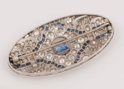 A Stunning Art Deco platinum oval brooch, set with diamonds and blue sapphires, early 20th century. PROVENANCE: Originally the property of LOUISA (LuLu) NATHAN of RIPPON LEA&nbsp;in Melbourne (Now a National Trust house). Passed down to her son BEN JONES and h - 2