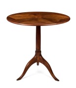 An antique French&nbsp;walnut tilt-top occasional table with segmented top, satinwood paterae, cylinder trunk and tripod base, 19th century, 74cm high, 71cm diameter