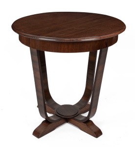 An Australian Art Deco oak occasional table with moulded circular top, shaped legs and sledge feet, 72cm high, 74cm diameter