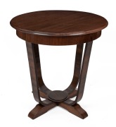 An Australian Art Deco oak occasional table with&nbsp;moulded circular top, shaped legs and sledge feet, 72cm high, 74cm diameter