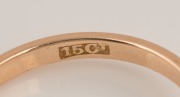 An antique 15ct yellow gold ring, set with a blue sapphire, flanked by two diamonds, mounted in platinum, 19th century, stamped "15ct", ​​​​​​​3.7 grams - 3
