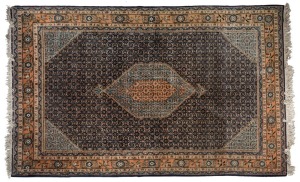 Ardibil hand-knotted Persian wool rug on blue ground, 295cm x 200cm.  With accompanying certificate and valuation