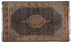 Ardibil hand-knotted Persian wool rug on blue ground, 295cm x 200cm. With accompanying certificate and valuation