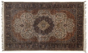 Kashmir hand-knotted wool rug on blue and beige ground, 275 x 183cm