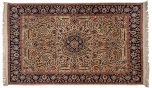 A Persian hand-knotted wool rug on cream ground with navy border, 227 x 140cm