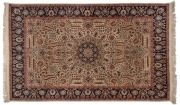 A Persian hand-knotted wool rug on cream ground with navy border, 227 x 140cm