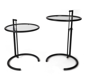 EILEEN GRAY E1027 matched pair of Art Deco style occasional tables, black metal and glass, 21st century, 67cm high, 51cm diameter