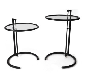 EILEEN GRAY E1027 matched pair of Art Deco style occasional tables, black metal and glass, 21st century, ​​​​​​​67cm high, 51cm diameter