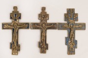 OLD BELIEVERS three Russian bronze crosses with remains of blue and white enamel decoration, 20th century, the largest 16.5cm high