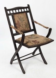 An antique walnut folding chair in the Aesthetic Movement style, 19th century, 89cm high, 50cm across the arms